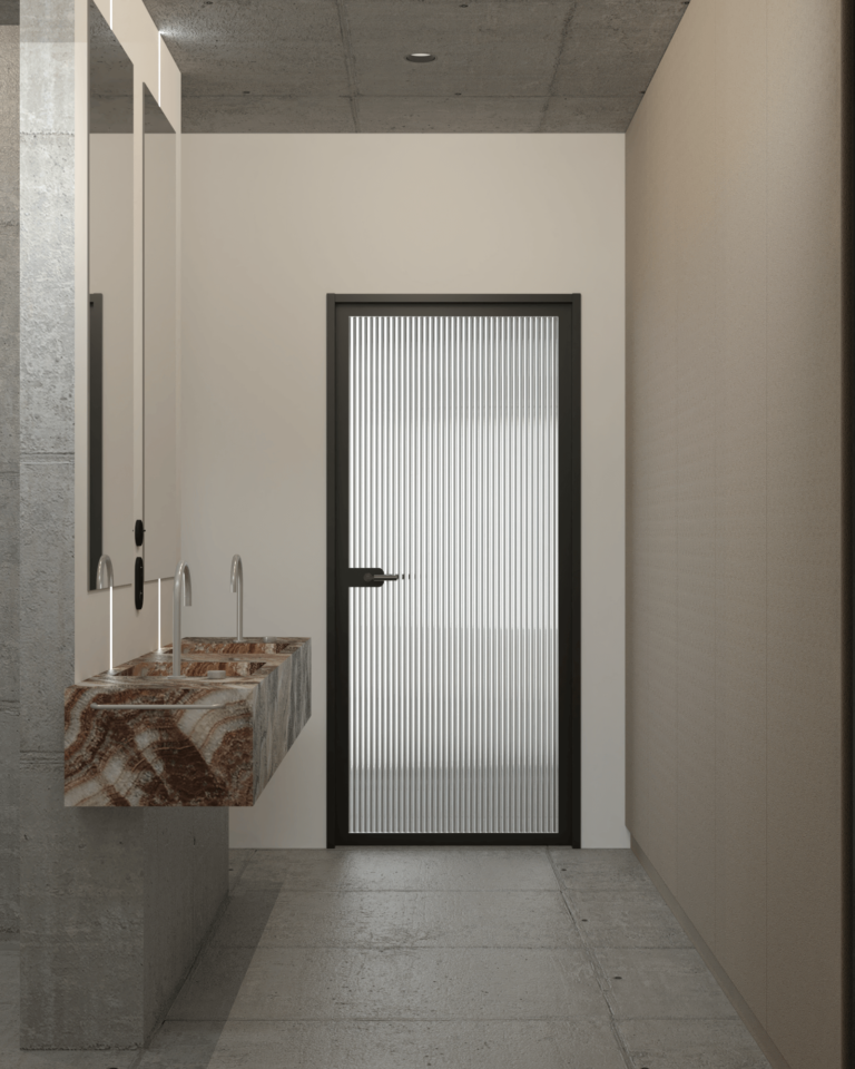 projekt wnętrza mieszkania z betonowym stropem i podłogą łazienka z kamienną umywalką zintegrowaną ryflowane drzwi ze szkła flutes