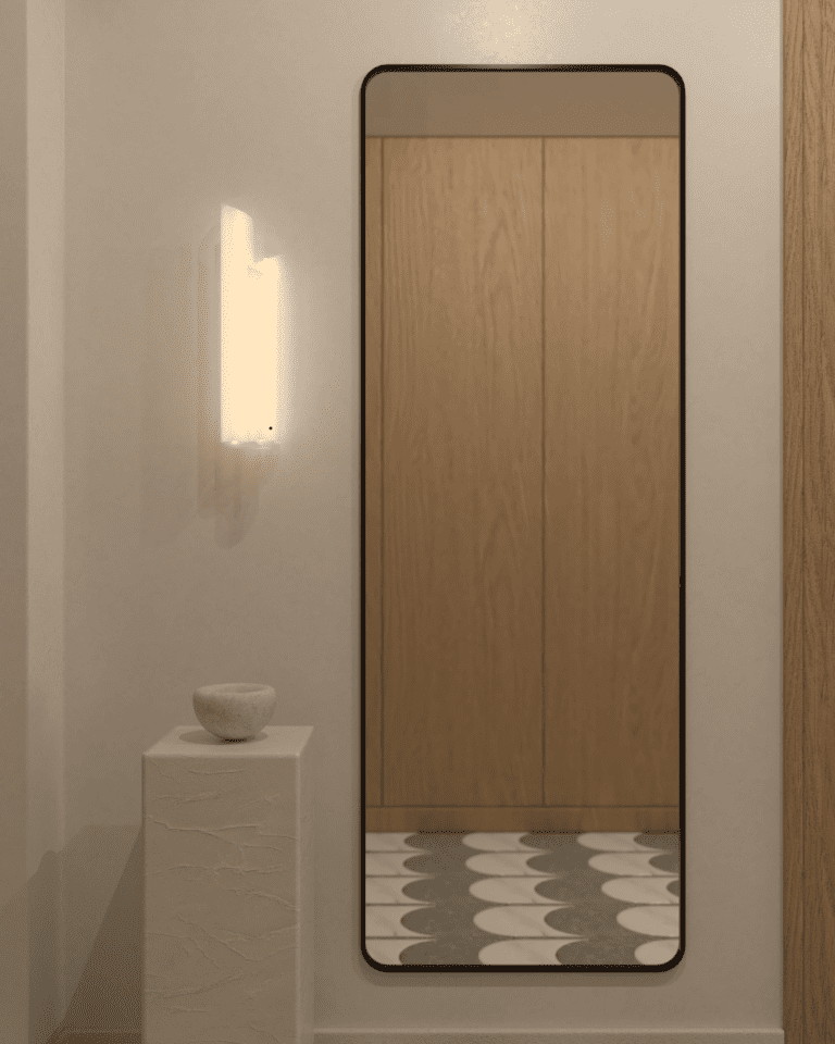 projekt wnętrza mieszkania klimatyczne mieszkanie w stylu retro korytarz dębowa podłoga wysokie drewniane drzwi kinkiet artemide chimera lustro kwadratowe w czarnej ramie płytki mozaika Terratinta Vicentina